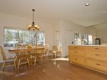 Sunny fully equipped kitchen with seated dining